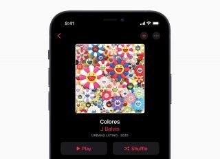 Close up image of top half screen of an iPhone 12 displaying J Balvin Colores on Apple music