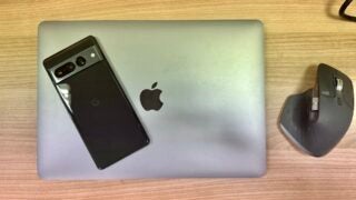 A Google Pixel 7 Pro laying on a MacBook Pro