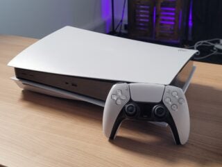 PS5 console on its side with the controller