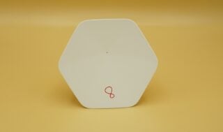 A white Virgin Intelligent WiFi Pod standing on a table